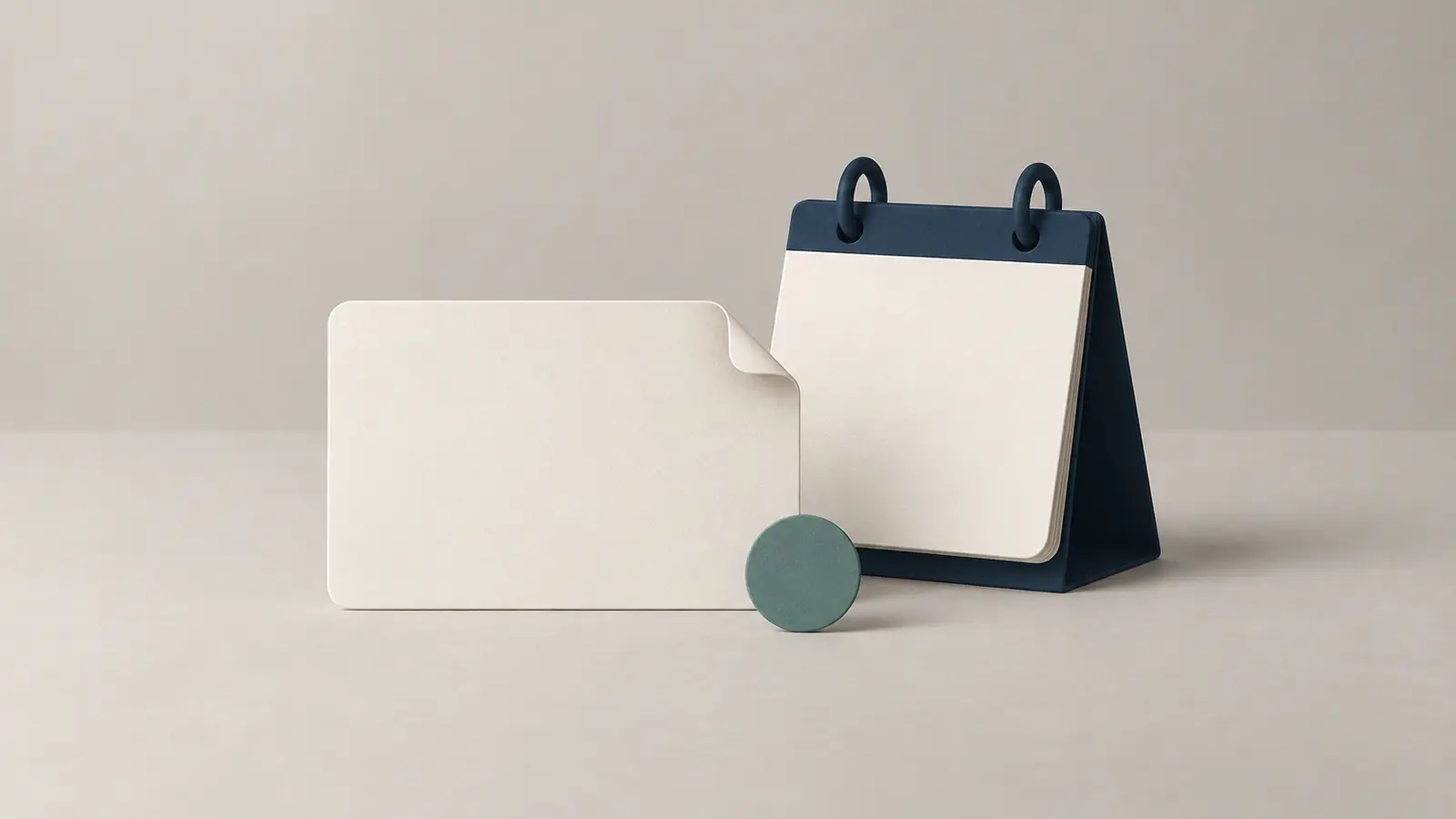 A blank company-record card with a turned corner beside an unmarked navy desk calendar and a teal status marker.